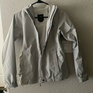 Light grey windbreaker, good for hiking, backpacking
